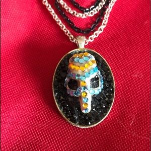 Weird mouse skull necklace.